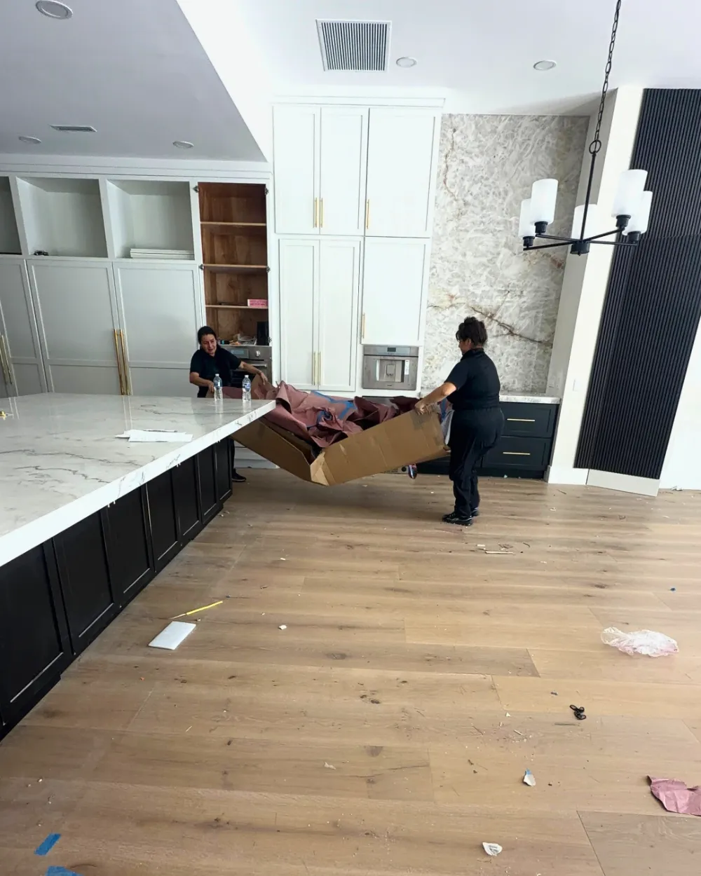 Post-construction cleaning Jacksonville – kitchen before cleaning, floor covered in debris